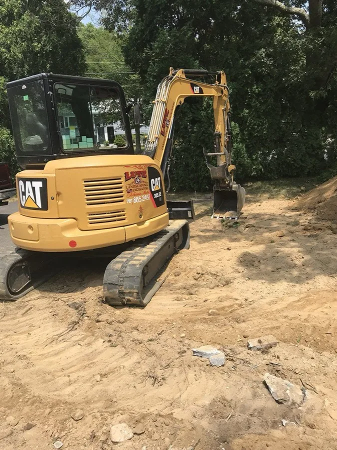 Lutz-branded CAT mini-excavator on a job site