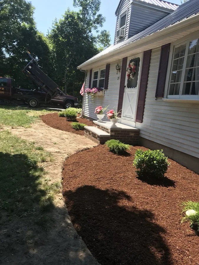 Freshly mulched garden bed with flowers