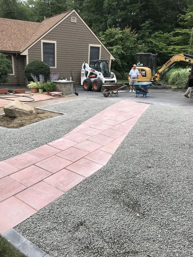 In-ground pool excavation next to a home